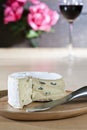 Blue cheese on wooden plate