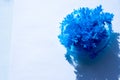 Blue chemical crystals forming. needle like Urea crystals ,carbamide, forming by evaporation of water. blue salt crystal