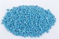 Blue chemical fertilizer on white background.