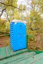 Blue Chemical Toilet in the Woods