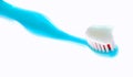 Blue children`s toothbrush with toothpaste environmental