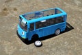 Blue childrens toy bus car with dislodged tires