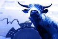 Blue chip and bull on a stock market chart