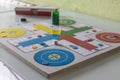 Blue chip at home in a game of parcheesi, entertainment, hobby, fun