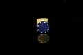 Blue chips stack with a White chip in front isolated on black with reflection Royalty Free Stock Photo