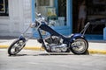 Blue motorcycle chopper parked on the street