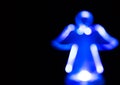 Blue Christmas angel light silhouette isolated on black background with copy space. Royalty Free Stock Photo