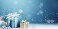 Blue Christmas background decorated with white gifts and snowflakes, copy space