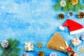 Blue Christmas background with fir branches, red giftboxes, silver and golden decorations, copy space. Top view Royalty Free Stock Photo