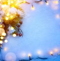 Blue Christmas background with snow fir tree and holidays light. Royalty Free Stock Photo