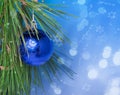 Blue Christmas ball on green branch Royalty Free Stock Photo