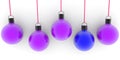 Blue Christmas ball among purple Christmas balls Royalty Free Stock Photo