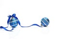 Blue Christmas ball with ribbon bow on white background Royalty Free Stock Photo