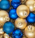 Blue Christmas balls and gold, beads lie in a wooden basket top Royalty Free Stock Photo