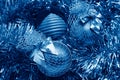 blue christmas balls on a golden tinsel Royalty Free Stock Photo