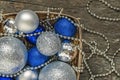 Blue Christmas balls and silver, beads lie in a wooden basket to Royalty Free Stock Photo