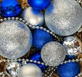 Blue Christmas balls and silver, beads lie in a wooden basket to Royalty Free Stock Photo