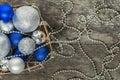 Blue Christmas balls and silver, beads lie in a wooden basket to Royalty Free Stock Photo