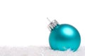 A blue Christmas bauble, ball or decoration on white background Royalty Free Stock Photo