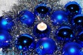 Blue Christmas baubles and a candle Royalty Free Stock Photo