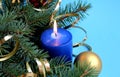 Blue candle lit on holiday christmas background Royalty Free Stock Photo