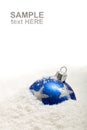 Blue christmas decoration in snow with copy space Royalty Free Stock Photo