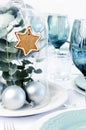 Blue christmas dinner table setting with glass dome centerpiece Royalty Free Stock Photo