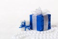 Blue Christmas gift box with shiny silver ribbon and beads Royalty Free Stock Photo