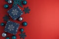 Blue Christmas Gift Boxes and Ornaments on Red Holiday Background Royalty Free Stock Photo