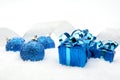 Blue christmas gifts,baubles silver ribbon on snow Royalty Free Stock Photo