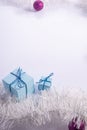 Blue Christmas gifts with fir-tree cones, on a white background. vertical shot Royalty Free Stock Photo