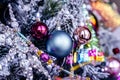 Blue Christmas glass bauble and pink ball decoration hanging on a snowy tree bg Royalty Free Stock Photo