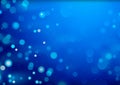 Blue Christmas Glittering Background with Bokeh Effect