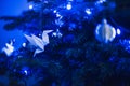 Blue Christmas lights white origami baubles