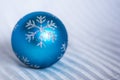 blue christmas tree ball with snowflake ornament on white background, close up, space for text, horizontal / Christmas tree ball Royalty Free Stock Photo