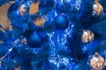 Blue Christmas tree with blue decorations. Monochrome decoration of Christmas and New Year. Stylish and magical, unusual