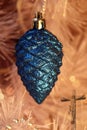 Pine cone Christmas ornament with lights and crucifix