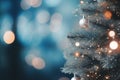 Blue Christmas Tree with Glittering Stars and Bokeh Lights in Abstract Defocused Background Royalty Free Stock Photo