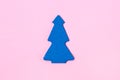 Blue Christmas Tree on Light Pink Background Top View Flat Lay Christmas Card or Background Minumal Concept Holiday Concept