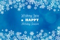 Blue Christmas winter background with greeting text and frame of snowflakes Royalty Free Stock Photo