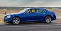 Blue Chrysler 300 in Badlands National Park Royalty Free Stock Photo