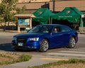 Blue Chrysler 300 parked in front of the Ben Reifel Visitor Center Royalty Free Stock Photo