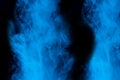 Blue cigarette vapor vertical patterns ghostly and mysterious