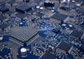 Blue circuit board featuring numerous microchips and integrated Royalty Free Stock Photo