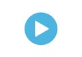 A blue circular icon with a white triangle pointing to the right in the center, commonly representin Royalty Free Stock Photo