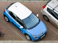 Blue Citroen C3 compact French car with white roof parked on street