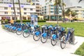 Blue City Bike shared bicycles for rent are lined up in the streets of Miami. Royalty Free Stock Photo