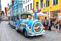 Blue City Train, tourist sightseeing vehicle, is driven through Pikk Steet in the Old Town of Tallinn, Estonia