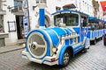 Blue City Train, tourist sightseeing vehicle, is driven through Rataskaevu Steet in the Old Town of Tallinn, Estonia