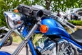 Blue classic motorbike stands on street